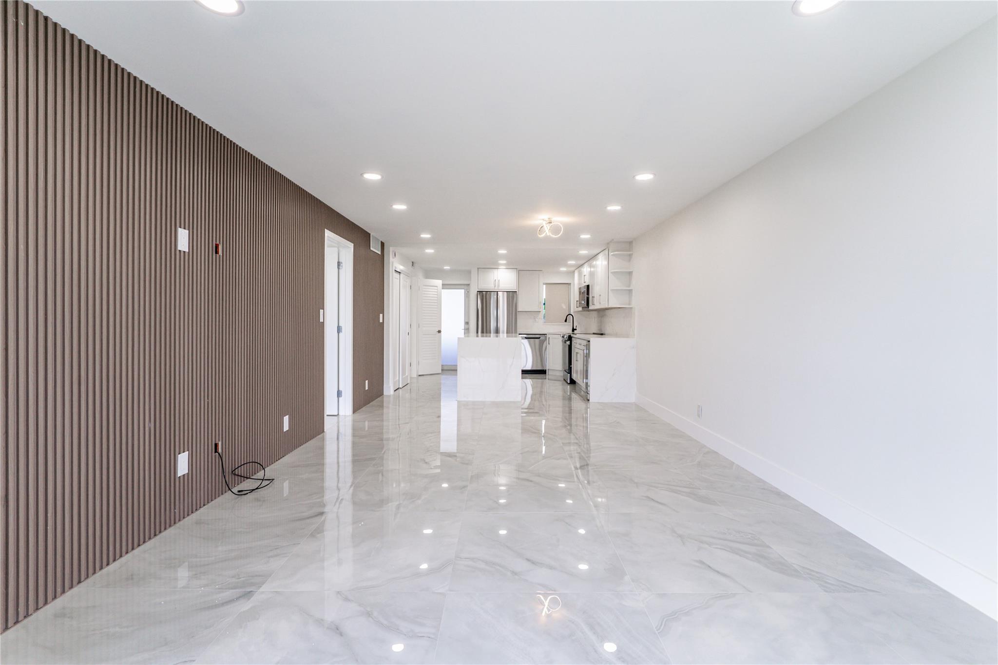 WOW! FULLY RENOVATED LIKE NO OTHER! TOO MANY EXTRA SPECIAL FEATURES TO NAME! MAGNIFICENT PGA GOLF, TENNIS, POOL & LAKE VIEWS! 4TH Floor 1BR/1.5BA +. WASHER/DRYER. TOTALLY OPEN FLOOR PLAN. Kitchen features SS appliances, granite island & counters, wine cooler, IMPACT WINDOWS/DOOR. Large porcelain floors throughout. Expanded living area w/ enclosed open balcony. Recreation Lease PAID IN FULL! FREE golf (except cart fees) on two 18 hole courses (PGA & Par3); Amenities include Restaurant, Billiard Room, Bbq/Picnic Area, Clubhouse, Courtesy Bus, Exercise Room, Heated Pool, Library, Putting Green, Sauna, Shuffleboard, Tennis, Pickle Ball, Vehicle Wash Area, Electric Car Charging Station. Close to shops, dining & highways. 15 min. to the beach. Association says 55+ age required; BEYOND PERFECT!