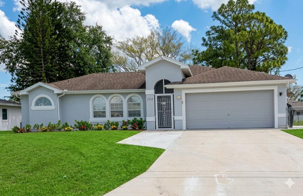 Photo of 1717 SW Burlington Street, Port Saint Lucie, FL 34984 (MLS # B26021720)