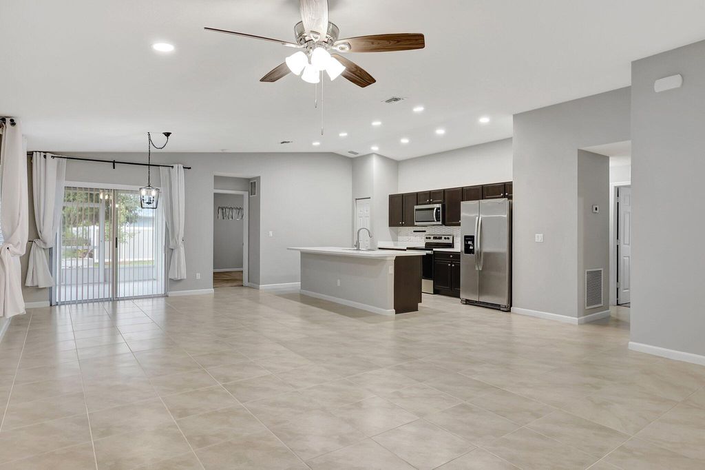 Photo of 577 NW Floresta Drive, Port Saint Lucie, FL 34983 (MLS # B26009460)