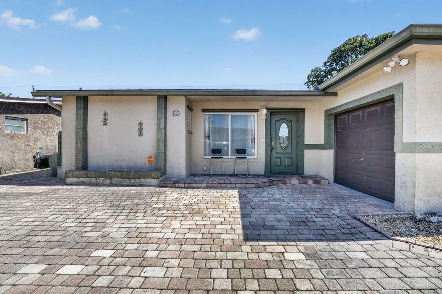 Beautifully remodeled 3-bedroom, 2-bathroom single-family home with a pool and NO HOA! This move-in ready home features ceramic tile flooring throughout, granite kitchen countertops, and a beautifully upgraded primary suite with barn closet doors and a refinished bathroom. Enjoy outdoor living with a fully paved circular driveway and pool deck. A perfect blend of comfort, style, and convenience! Pay no property taxes for the rest of 2026! Rain Soft water filtration system for the whole house- including the washer - and a separate 4-Sump Alkaline Filter for the kitchen sink. Rain Soft Air system on the AC to purify the air.  Roof is July 2022. The AC is 2019. Garage is currently converted into an extra large storage room.