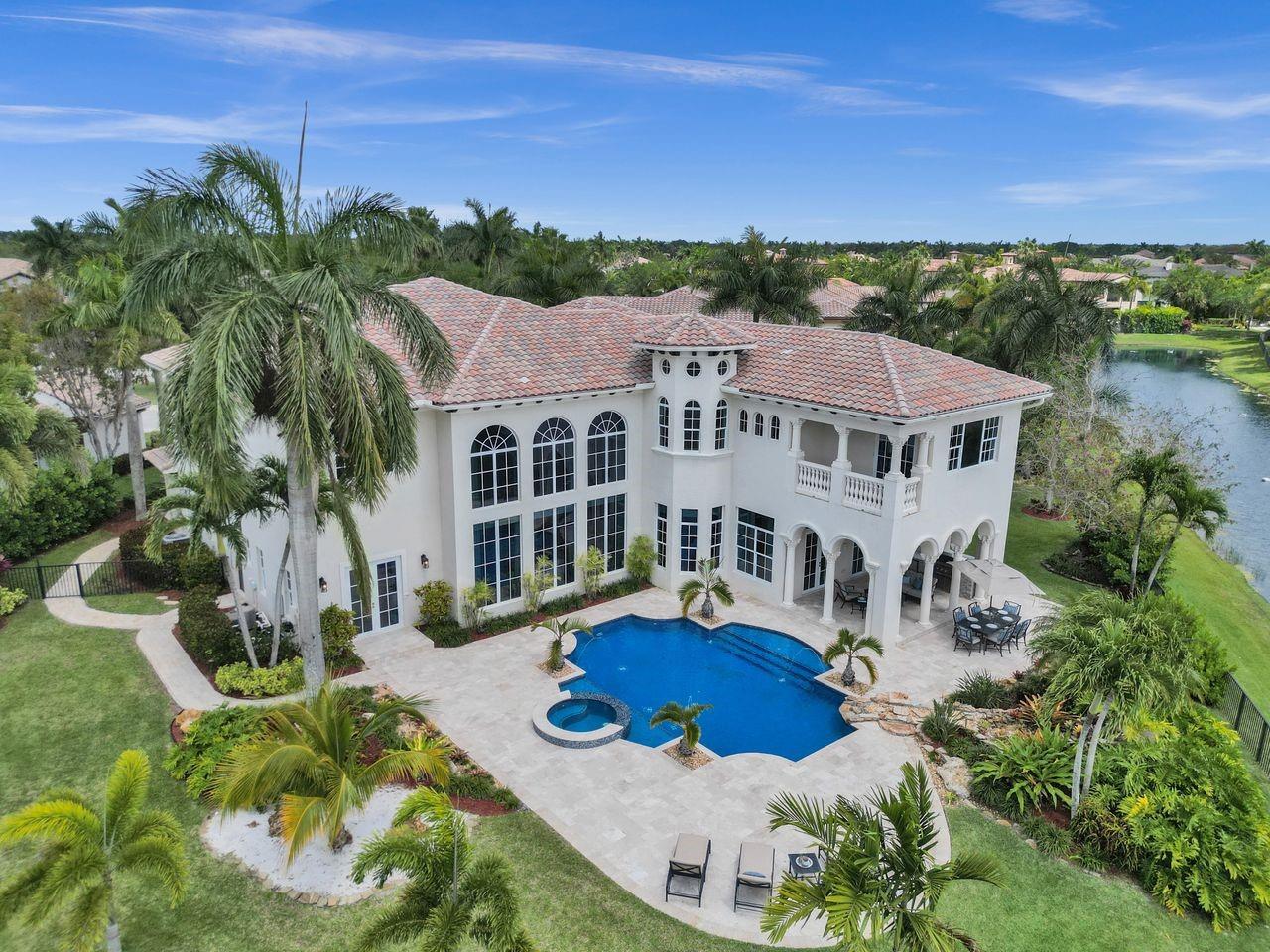 Magnificent 5+Den/5.5BA, over 6000sf w/state-of-art soundproof theater. Over half acre, panoramic fully fenced lakefront lot framed by passive park with spectacular resort pool/spa, summer kitchen, marble terrace. Set back from wide cul-de-sac, the grandeur of the long driveway & entrance sets the stage for luxury living in this prestigious guard gated enclave. Majestic steel/impact front doors, 30ft soaring ceilings & walls of impact glass illuminate the elegance of the stunning interior. Chefs kitchen w/high-end gas appliances & Butler's Pantry. Downstairs den/office & guest w/cabana bathroom ensuite. Primary w/gym & balcony. Laundry w/custom cabs, 2 sets of W/D. Impact glass, motorized window treatments, gas fireplace, 500-gallon propane tank. A+ schools. For the most discerning tenant.