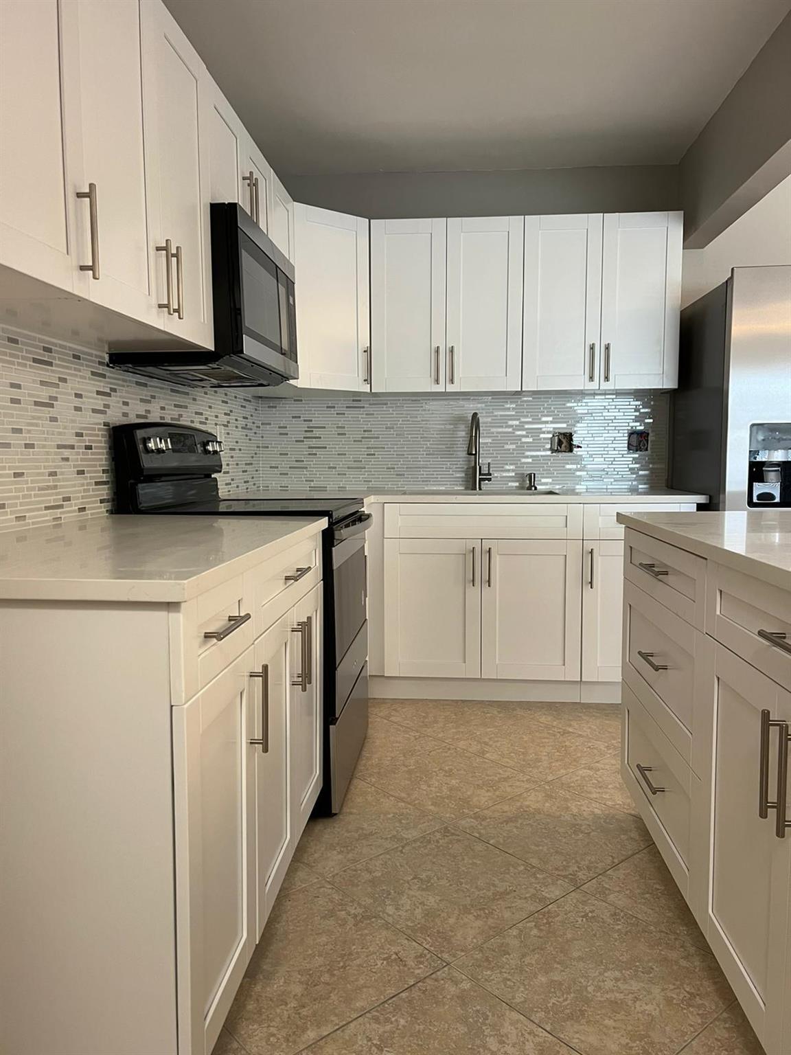 Beautiful Renovated 3/2, New wood custom Kitchen with Quartz counters and New Stainless Steel Appliances, New Roof, Renovated Bathrooms, All tiled NO Carpet!, 1 Car Garage and great back yard All fenced! Amazing Location next to the Palm Beach Gardens Mall, and really close to the beach! Hurry this wont last!