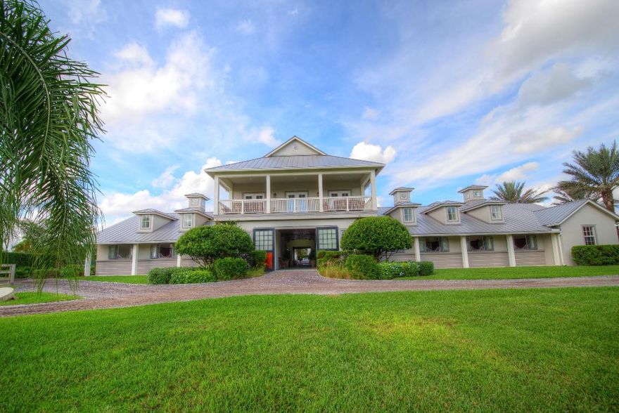 Extraordinary farm ownership opportunity in desirable Saddle Trail South. This private 6.3 acre equestrian compound is located within a very short hacking distance to the showgrounds. The stable features 17 12’x12’ Corton stalls, 3 tackrooms with kitchenettes, office, 2 half-bathrooms, 2 storage rooms, feed room, air-conditioned hay room, 7 grooming/wash stalls, vet/farrier stall with exterior access, and laundry. The second story boasts an owner’s lounge, full bathroom, workout room with rubber flooring, and balcony overlooking the grounds. Two 2-bedroom, 1 bathroom apartments complete with granite countertops, stainless steel appliances and full laundry facilities overlook the courtyard. Designed for the serious competitor, the grounds include 6 large paddocks, a covered Kraft 4-horse walker with center storage, detached utility building for tractor and jump storage, and an unparalleled 250'x190' sand riding ring with ride-on ride-off bank and 220'x200' derby field both with zoned irrigation. 

The spacious 4 bedroom plus den, 3.2 bathroom house has been extensively renovated boasting Carrera marble in the bathrooms, walk-in closets with custom cabinetry, impact windows, separate mud and laundry rooms, 2015 kitchen appliances and a "bonus room" complete with parquet flooring, built-in bookshelves and benches and a custom Mahogany wood bar with professional grade appliances. 

Additional features include whole house and barn generators, reverse osmosis water systems, security system with interior and exterior cameras, 3 separate entry gates, automatic fly spray system, and commercial ice maker in the barn. Grindstone Farm is the complete property for the serious equestrian.