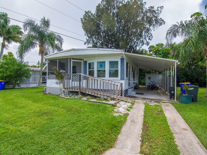 Fantastic Opportunity! Move-in ready home perfect for first-time buyers or investors located in beautiful Stuart, FL! This charming 2-bedroom, 2-bath manufactured home features open layout, new hurricane impact windows, updated kitchen and baths and a new AC in an all-age, pet-friendly community located across from the Harley Davidson shop.  The private backyard, covered carport, indoor laundry, and storage shed add convenience and comfort, while the laminate and tile flooring create a modern, low-maintenance appeal. Priced at just $80,000 with lot rent of $860/month, this property is an incredible value—perfect for year-round living or a seasonal getaway in sunny Florida
