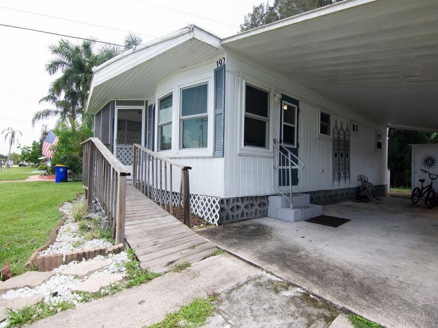 Fantastic Opportunity! Move-in ready home perfect for first-time buyers or investors located in beautiful Stuart, FL! This charming 2-bedroom, 2-bath manufactured home features open layout, new hurricane impact windows, updated kitchen and baths and a new AC in an all-age, pet-friendly community located across from the Harley Davidson shop.  The private backyard, covered carport, indoor laundry, and storage shed add convenience and comfort, while the laminate and tile flooring create a modern, low-maintenance appeal. Priced at just $80,000 with lot rent of $860/month, this property is an incredible value--perfect for year-round living or a seasonal getaway in sunny Florida