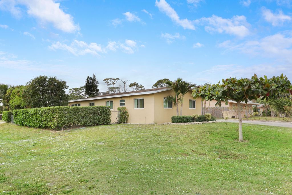 Photo of 827 Caroline Avenue, West Palm Beach, FL 33413 (MLS # B26052692)