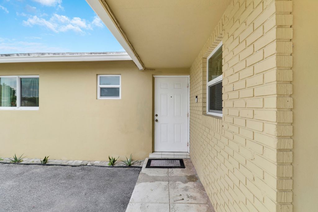 Photo of 827 Caroline Avenue, West Palm Beach, FL 33413 (MLS # B26052692)