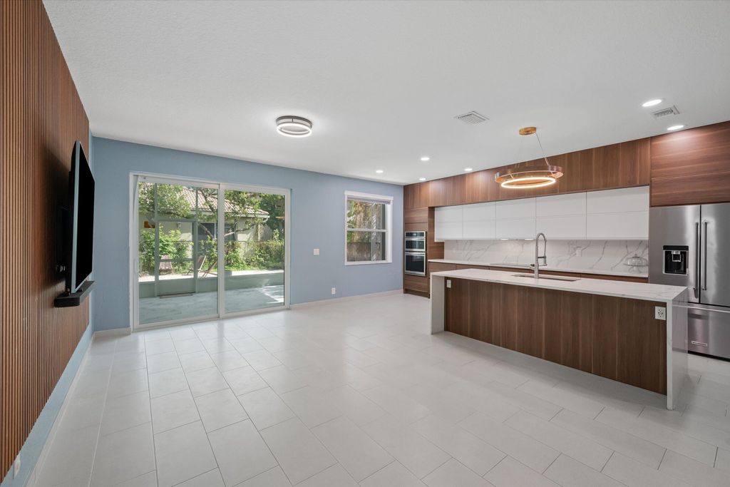 Photo of 1222 Rose Gate Boulevard, Riviera Beach, FL 33404 (MLS # R11158166)