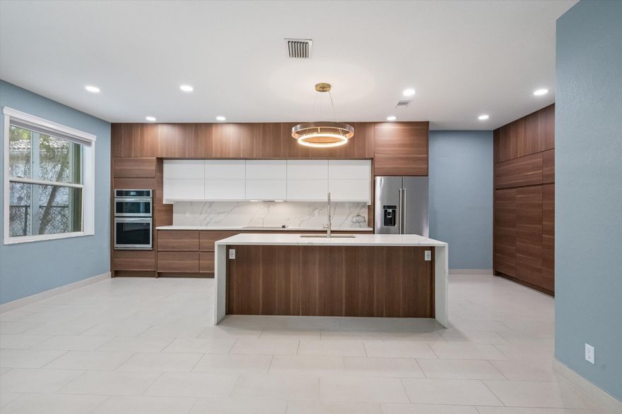 Wow! This beautifully updated 4-bedroom, 
3-bath home offers a modern layout and stylish finishes throughout.  The home features newly renovated bathrooms with contemporary tile, frameless glass showers, and sleek fixtures.A thoughtfully designed mudroom adds everyday convenience and extra storage.
The updated kitchen showcases modern cabinetry with ample storage, quality countertops, and a functional island ideal for cooking and hosting. Light-filled living spaces and tasteful upgrades make this home move-in ready.
Outside, you can enjoy entertaining year-round with a Summer Kitchen perfect for outdoor dining.
Located in a man-guarded community, this home is centrally situated five minutes from the beach, outlets, shopping, restaurants, and PBI. It is truly the perfect place to call home.
This house has been appraised and appraisal is available upon an executed contract.