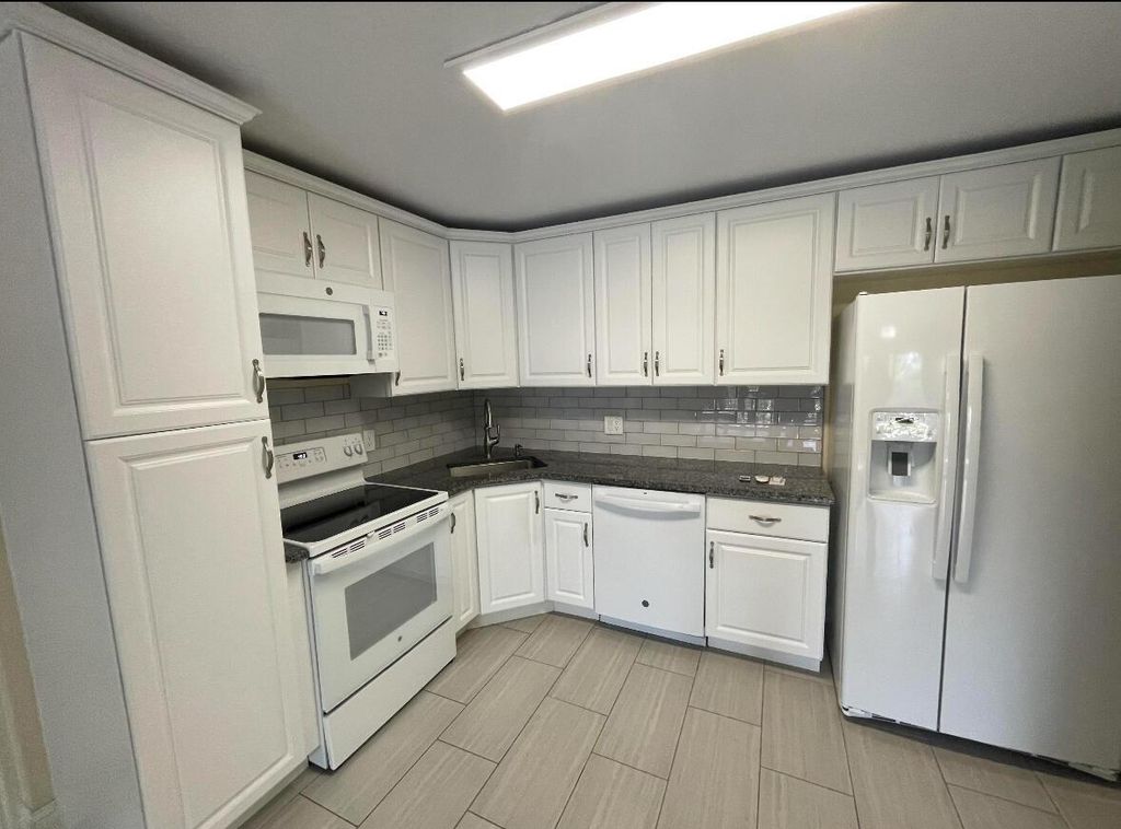 Photo of 205 Foxtail Drive #D3, Greenacres, FL 33415 (MLS # R11115497)