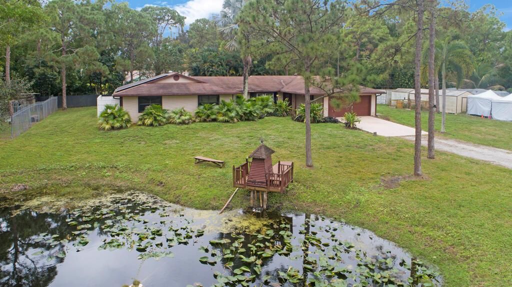 Photo of 12356 61st Lane N, West Palm Beach, FL 33412 (MLS # R11052948)