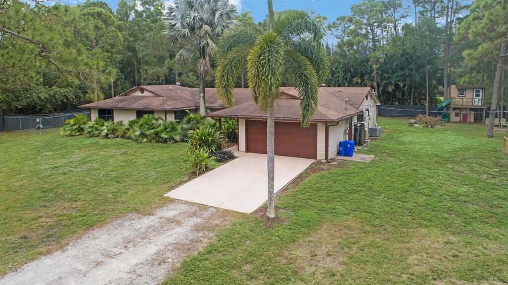 Photo of 12356 61st Lane N, West Palm Beach, FL 33412 (MLS # R11052948)