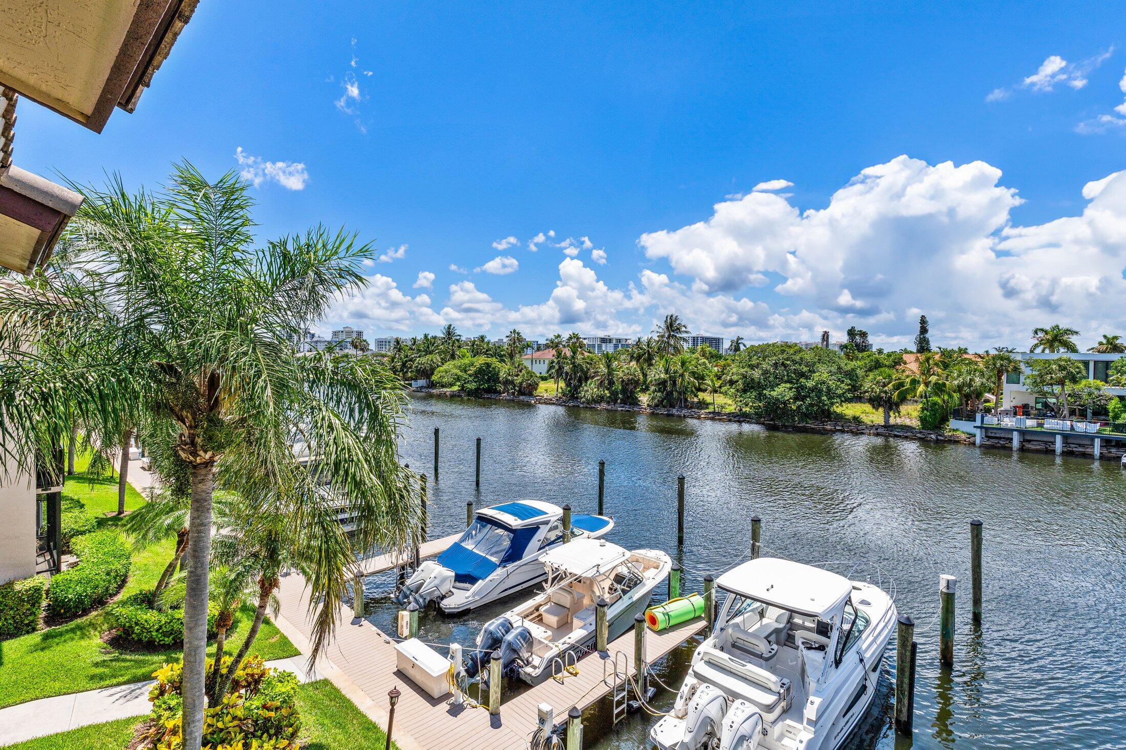 DIRECT WATERFRONT CAPTAINS WALK 2 STORY TOWNHOUSE CONDO IN 24 HOUR GUARD GATED BOATING COMMUNITY OF PELICAN HARBOR. LARGE KITCHEN WITH LIVING ROOM OVERLOOKING LARGE SCREENED PATIO WITH A DIRECT WATER VIEW OF THE MARINA. 2 MASTER SUITES ON TOP LEVEL WITH LARGE CLOSETS. MASTER HAS BALCONY WITH DIRECT WATER VIEW. BOAT SLIPS AVAILABLE FOR RENT FOR BOATS AS LARGE AS 50+ FEET. ROLL DOWN SHUTTERS FOR ADDED PROTECTION. ASSIGNED CARPORT PARKING. MOTORCYCLES & PICKUP TRUCK ARE WELCOME. IN GUARD GATED PELICAN HARBOR WITH 2 RESORT STYLE COMMUNITY POOLS, LIGHTED TENNIS AND PICKLEBALL COURTS, GYM & CLUBHOUSE DIRECTLY ON THE WATER WITH A HUGE HARBOR FRONT DECK. MINUTES FROM ATLANTIC AVE ENTERTAINMENT DISTRICT & THE BEACH.