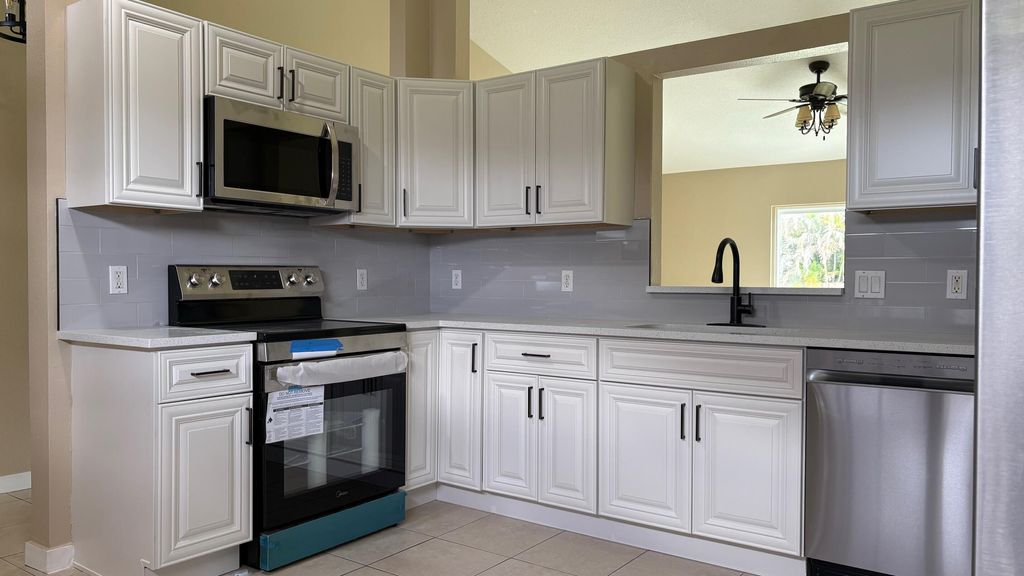 Photo of 637 SE Tanner Avenue, Port Saint Lucie, FL 34984 (MLS # B26018550)