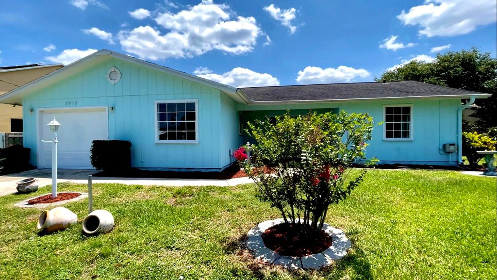 Photo of 2450 SE Sidonia Street, Port Saint Lucie, FL 34952 (MLS # R10810574)