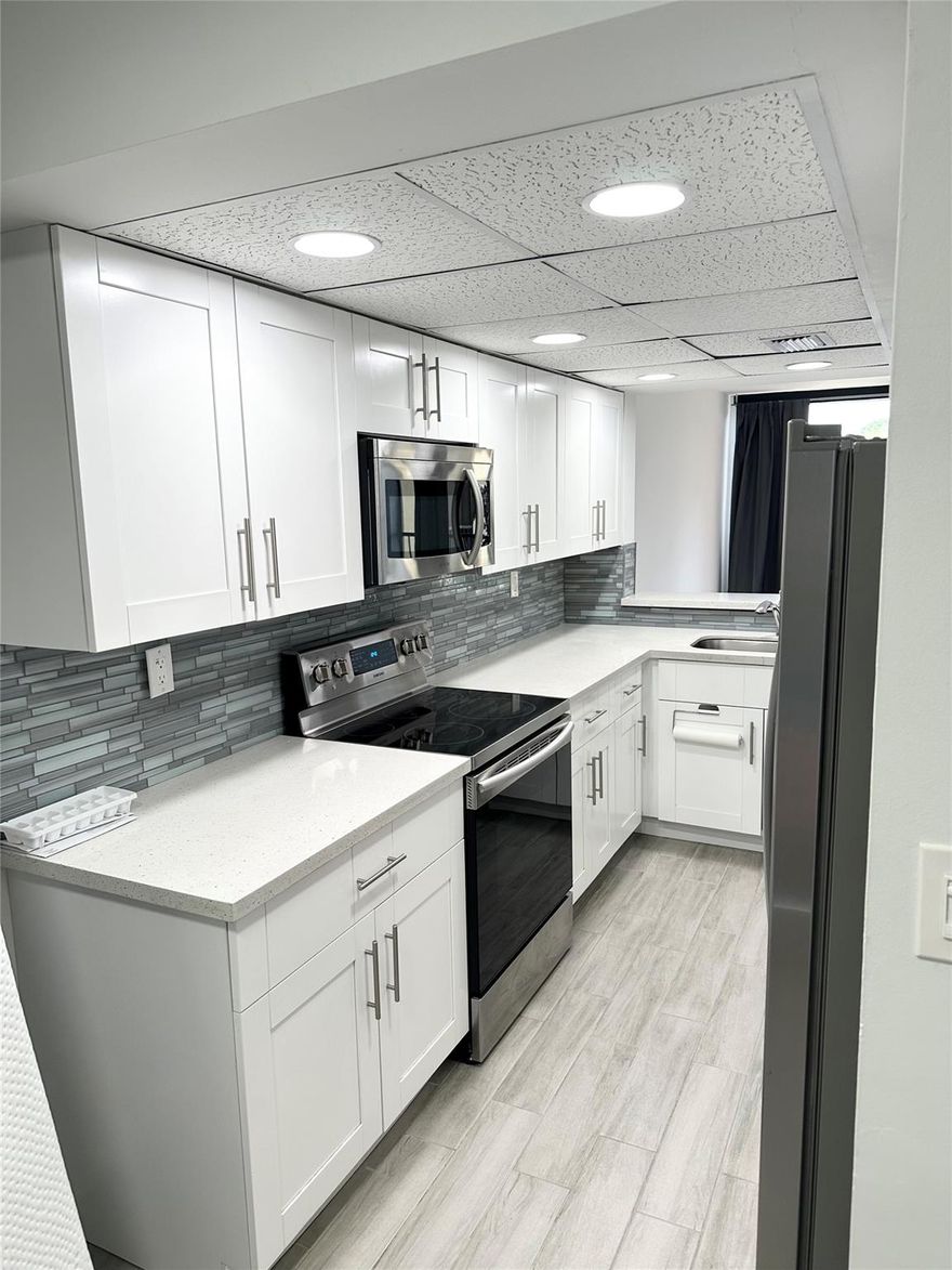 Totally remodeled townhouse in West Davie.  Less than a mile from Nova Southeastern and Broward College ETC.  Great school district, close to 595, turnpike and 75. Grey plank porcelain tiles downstairs with grey laminate upstairs.  No Carpet. Beautiful kitchen with white shaker cabinets, quartz countertops and stainless appliances.  Beautiful view of the lake with fountain. Screened in balcony off living area and Master Bedroom.  Full sized laundry room on main floor.  Community pool, Water, Sewer and Trash included with rent. Available immediately. Pets allowed with deposit.  Two Master bedrooms.  Perfect for roommates.