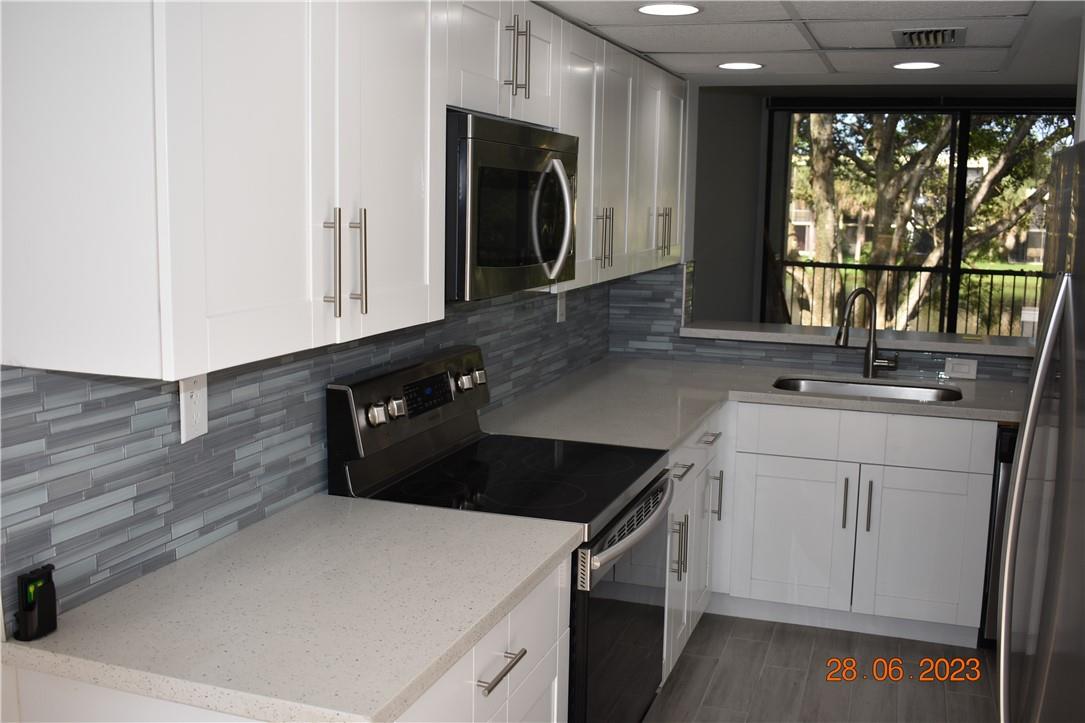 Totally remodeled townhouse in West Davie.  Less than a mile from Nova Southeastern and Broward College ETC.  Great school district, close to 595, turnpike and 75. Grey plank porcelain tiles downstairs with grey laminate upstairs.  No Carpet. Beautiful kitchen with white shaker cabinets, quartz countertops and stainless appliances.  Beautiful view of the lake with fountain. Screened in balcony off living area and Master Bedroom.  Full sized laundry room on main floor.  Community pool, Water, Sewer and Trash included with rent. Available immediately. Pets allowed with deposit.  Two Master bedrooms.  Perfect for roommates.