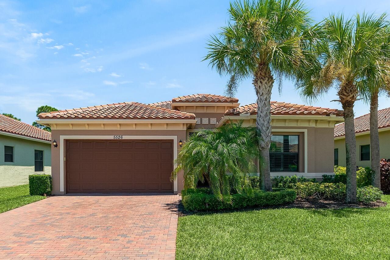 Resort like living awaits in this safe & comfortable 3/2/2 retreat. Solid CBS construction, impact windows/doors & a tile roof provide a sense of ease. The spacious and open floorplan provide a generous living space & dining area off the kitchen. Access to the rear patio, where you'll enjoy the evening breeze, is provided from both the living area & primary suite. Upon entering the primary, you'll notice the tray ceilings, walk-in closet & pristine bathroom w/ dual sinks. The inside laundry room & ultra private yard are the cherries on top! Amenities: pool, tennis, fitness, clubhouse & more.
