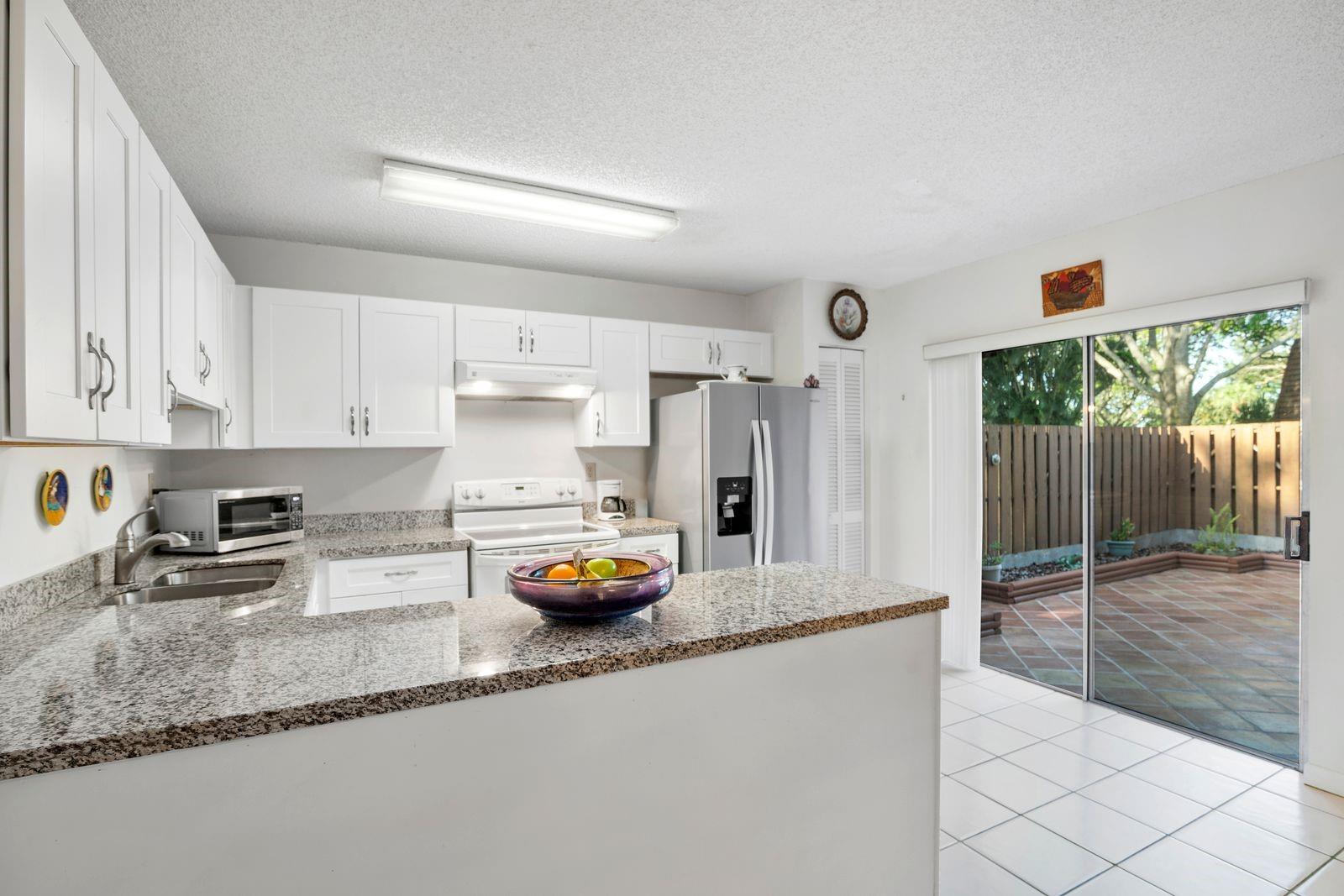 Location, Location, Location! Minutes from Nova University, major highways, and shopping. This spacious 2 bed, 2.5 bath townhouse in the desirable Patio Homes of Pine Island Ridge is ideal for investors or end users—rent immediately after purchase! Features include a large owner’s suite with walk-in closet, second bedroom with private bath, eat-in kitchen, half bath and laundry downstairs. Excellent opportunity in a prime Davie location!