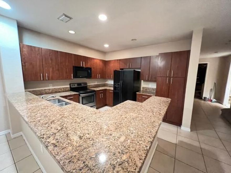 Pine Key community 3 large bedrooms, 2 .5 baths, 1 car garage. This home boasts an large spacious kitchen with upgraded cabinets.