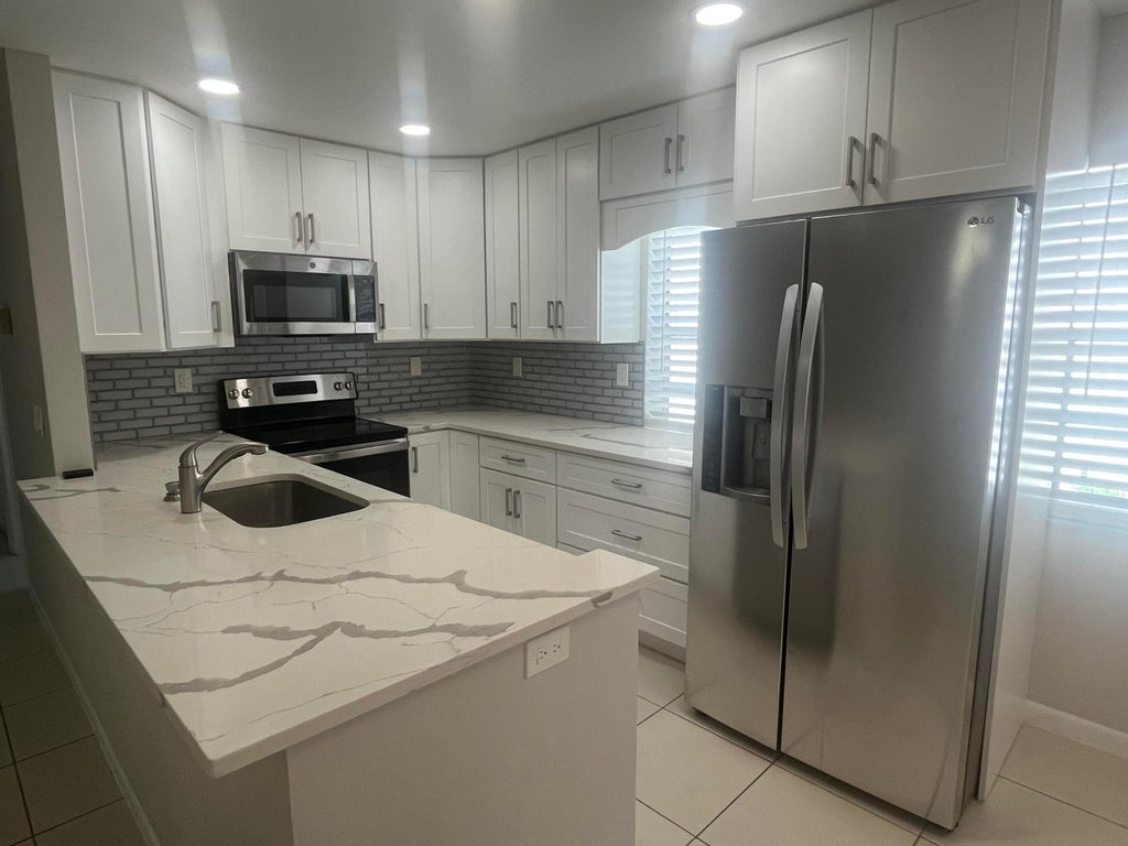 Photo of 93 Normandy B, Delray Beach, FL 33484 (MLS # B26066825)