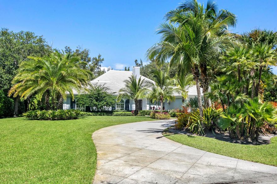 Stunning 5BD/3.1BA coastal contemporary home in exclusive Seminole Landing, a gated community with 24-hour security, private beach access, golf cart-friendly streets, and tennis courts. Nestled on a lush tropical 1-acre lot, this 3,952 sq ft home was fully renovated in 2022 with vaulted ceilings, impact windows, marble baths, and custom closets. The split floor plan includes 4 bedrooms and 2 baths in the family wing, plus a separate cabana suite opens to the outdoors, complementing the formal living, dining, and family rooms. Chef's kitchen features high-end appliances, induction cooktop, and wine cooler. Enjoy outdoor living with a covered kitchen, spacious patio, and tropical pool. Move-in ready luxury in one of North Palm Beach's most desirable neighborhoods.