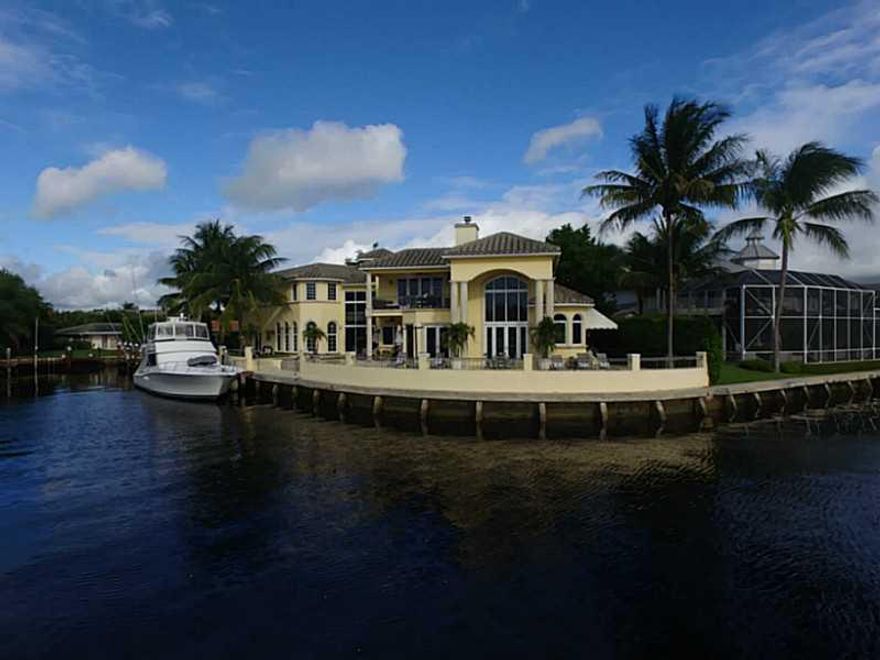 Situated on the most spectacular SE INTRACOASTAL POINT lot in all of Boca Raton, this showcase home offers unsurpassed quality and detailing throughout. Overlooking the tranquil Spanish River Park with incredible Intracoastal views in all directions, this  home is one of a kind with 166 feet of direct deepwater water frontage and dockage for a large yacht. The lavish gated estate offers over 6,800 air conditioned sq ft, 5 beds, 5 full and 2 half baths, library, chefs kitchen, master retreat suite and more!