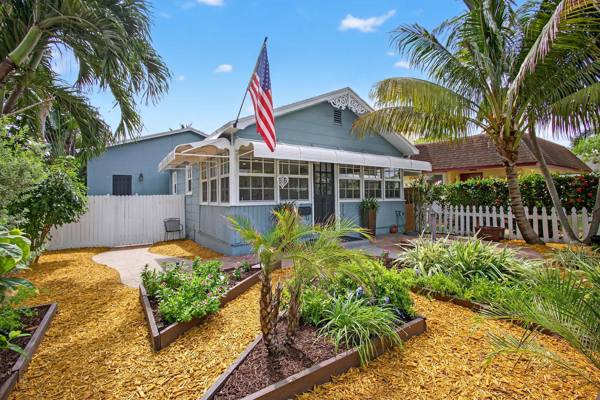 STOP! Have you been longing to find a coastal cottage that is an easy walk to the beach and downtown? You've just found it! This unique, historic cottage is conveniently located near the beach and downtown shops and dining. Smartly updated with impact windows, split-zone A/C (2022), and a tankless gas water heater (2019). The home features a spacious Florida room with tongue and groove ceilings and has been thoughtfully renovated with a modern farmhouse-style kitchen with Shaker cabinets, black granite counters, coffee bar, stainless appliances, 5-burner gas stove, as well as a renewed guest bedroom with bath. The 1216 sq.ft. addition (2009) includes formal dining, an expansive great room with 10-foot ceilings, a primary bedroom suite with walk-in closet and en suite bath, laundry