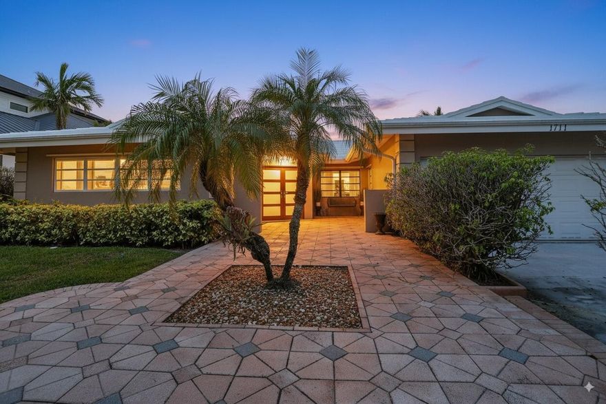 Experience the pinnacle of South Florida coastal living in this impeccably maintained single-story deepwater estate, offering 90 feet of prime Intracoastal frontage, a sparkling heated private pool, and the freedom of no HOA. This 4 bedroom, 2 bathroom, 2 car garage residence is thoughtfully designed for both everyday comfort and elevated entertaining. Ideally located just one block from the beach, the home seamlessly blends indoor and outdoor living with multiple areas for gathering, relaxing, and enjoying the tropical surroundings all in a highly sought-after, upscale enclave of Lauderdale-by-the-Sea.
