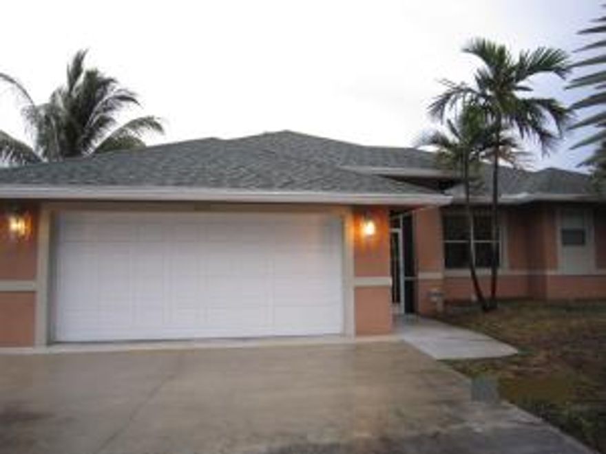 Canal home in a great location! Less than 3.5 miles to public beach and 1/2 mile west of I-95. Open floor plan with kitchen, living, and dining areas with privacy walls for kitchen from dining area and open at snack bar. Master has corner bathtub, tiled separate shower, and dual sinks. 1/1 Guest house with beautiful roman pillar porch located in back for incoming family and friends or to possibly rent out. Full bathroom in guest house with shower/tub combo and Wall A/C. Access to guest house from side of property through gate. Metal gate surrounding home for safety for children and pets. Dock with boat lift located in back. Boat lifts are great to pro-long the life of your boat. They also keep your boat safer, cleaner, and easier access to get out