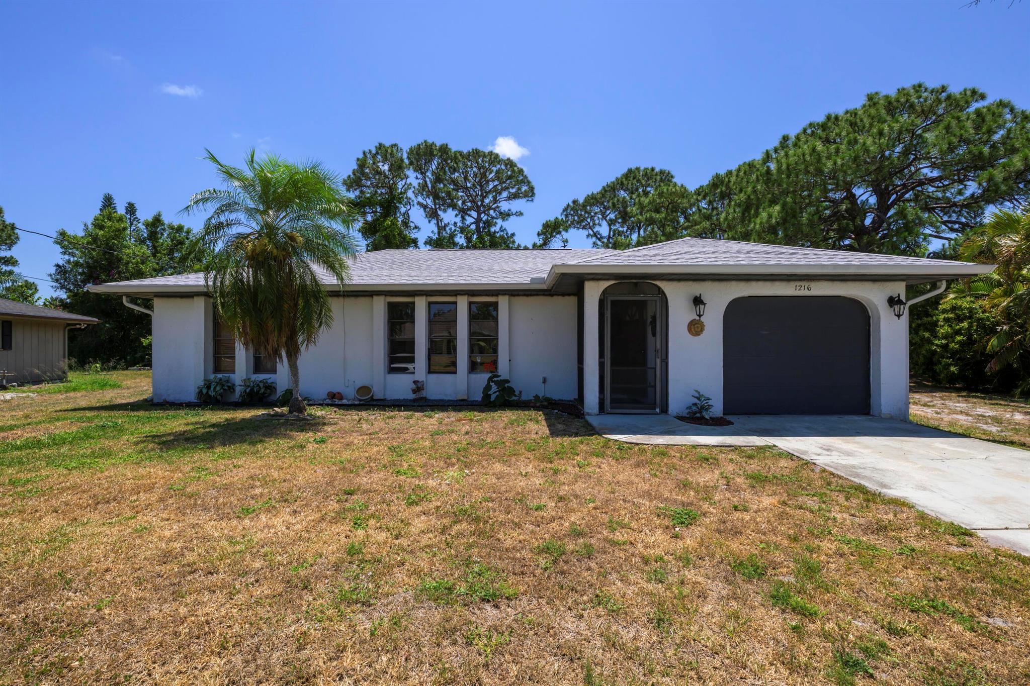 Charming 2/2 home in Port St. Lucie with a new roof (2022) and a new A/C (2025). This home features a bright, functional layout, spacious backyard, and no HOA. Close to shopping, dining, schools, and major highways. Great potential to make it your own! Seller is motivated!