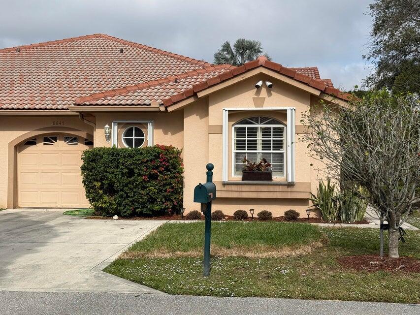 Spacious, single story villa in a highly desirable community! Beautiful 3-bedroom, 2-bath unit with a 1-car garage. Features vaulted ceilings in the living room, tile flooring throughout, updated appliances, large bedrooms and an oversized living area. Enjoy a covered, screened-in patio. Located in an excellent community with top-tier, resort style amenities, including a clubhouse, pool, hot tub, tennis courts, pickle ball courts, kids' play area, and 24-hour manned security. Close to parks, shopping centers, dining, excellent schools and more! No smokers, all ages.