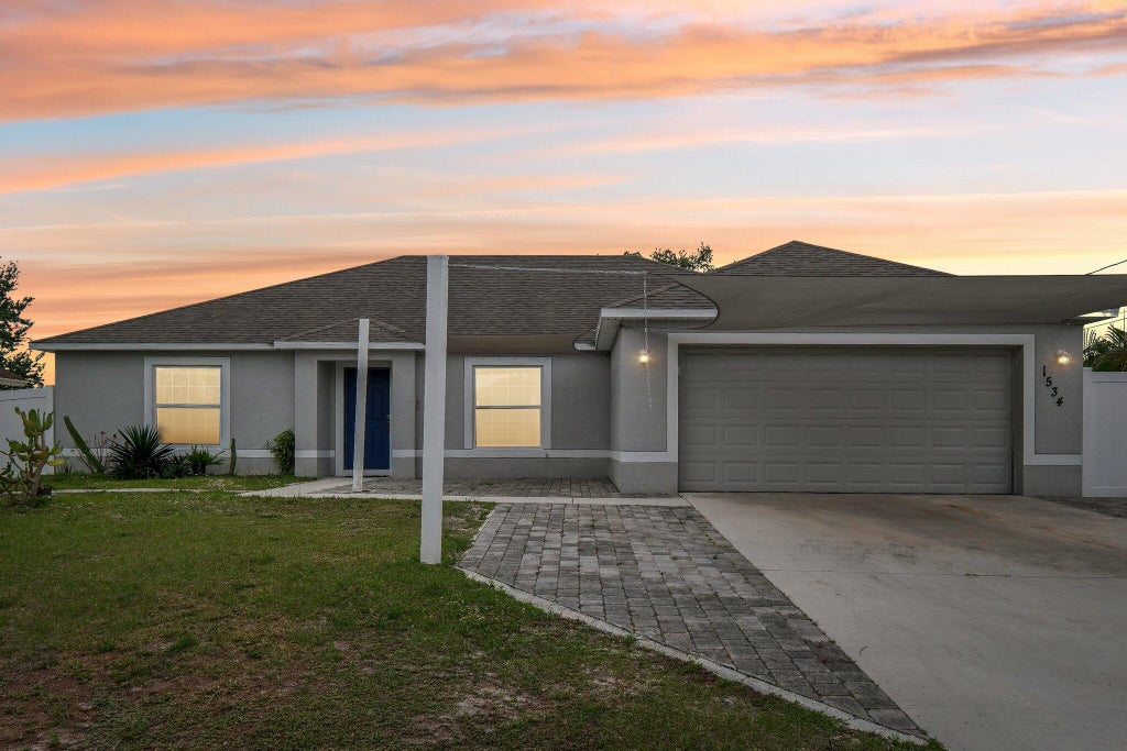 Photo of 1534 SW Jacksonville Avenue, Port Saint Lucie, FL 34953 (MLS # R11076780)