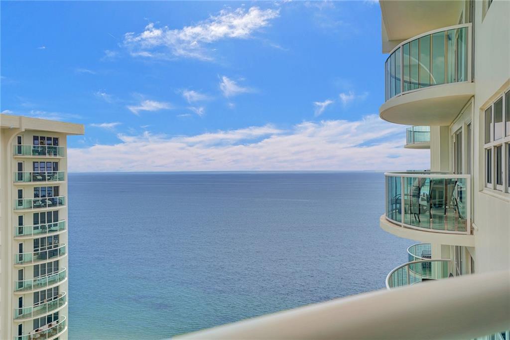Beautiful high floor ocean, intracoastal and pool views from this oceanfront, immaculate, tropical 21st floor apartment. This is a one bedroom that the owner has converted into another bright room, which is currently used as a second bedroom (with a closet),or perfect for a den. A pocket door closes off this room from the rest of the apartment. The kitchen has newer high end stainless Kitchen Aide (rarely used) appliances, an eat in area, and sliding glass doors leading out to the balcony. The roomy living room is light filled ,with a balcony door going out to the balcony. The primary bedroom has a double door entry and feels like a large, private suite. The tropical vibe continues into the primary bath, which has has a tub & glass enclosed shower. The half bath houses a washer and dryer.