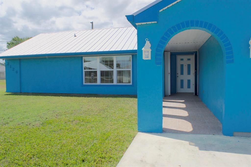 Photo of 2126 SE Midtown Road, Port Saint Lucie, FL 34952 (MLS # R10702191)