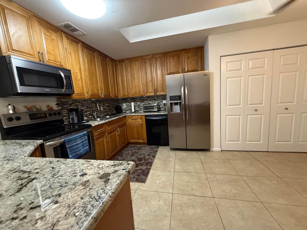 Photo of 242 Par Drive, Royal Palm Beach, FL 33411 (MLS # R11136337)