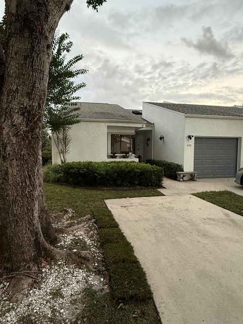 Photo of 242 Par Drive, Royal Palm Beach, FL 33411 (MLS # R11136337) Photo of 242 Par Drive, Royal Palm Beach, FL 33411 (MLS # R11136337)