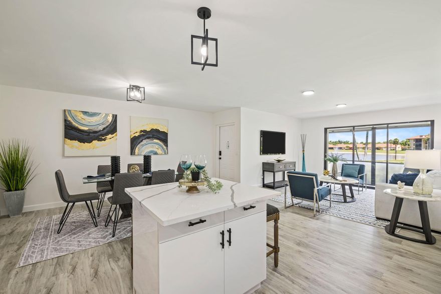 Welcome to this beautifully remodeled 3-bed, 2-bath corner unit in the sought-after 55+ community of Pine Ridge North Village IV. This first-floor condo features an open layout, a modern kitchen with upgraded appliances, updated bathrooms, and a custom walk-in closet in the primary suite. Enjoy peaceful lake views from your screened patio and the convenience of in-unit laundry and accordion shutters. Resort-style amenities include a clubhouse, pool, tennis, bocce, and walking trails. Hurricane accordian shutters gives you peace of mind. HOA covers cable, water, and exterior maintenance. Rentals allowed immediately--perfect as a home or investment!