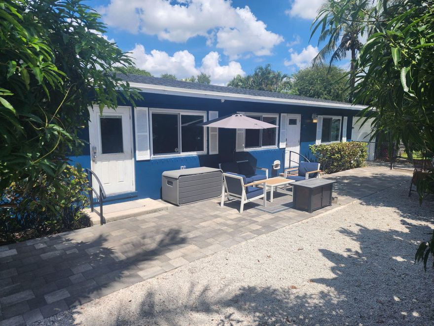 Owner owned and occupied DUPLEX  located in the heart of Palm Beach County.  Cute mid-century vibes, with attached 1 car garages on each side.  Fireplaces, above-ground propane, impact windows (2021) throughout!  Two Bedroom, 1 bath in each unit with recent updates/upgrades (bathrooms, roof 2023, water heaters 2023, septic work).  Pride of ownership is evident!  Possibility for short term rentals  - Buyer/Buyer Agent should verify regulations with appropriate county/city agencies.  Mature landscaping, fenced backyard, hard flooring throughout, and a retro feel that is sure to please!  A great configuration for investment, in-laws, etc.  More photos to come soon!