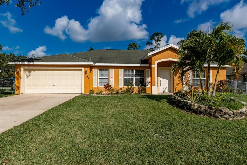 Photo of 1157 SW Goodman Avenue, Port Saint Lucie, FL 34953 (MLS # R10764711)