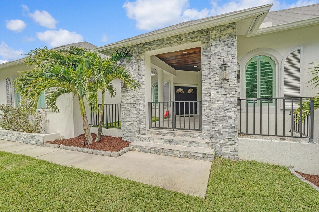 Photo of 921 SW Pine Tree Lane, Palm City, FL 34990 (MLS # R10991447)