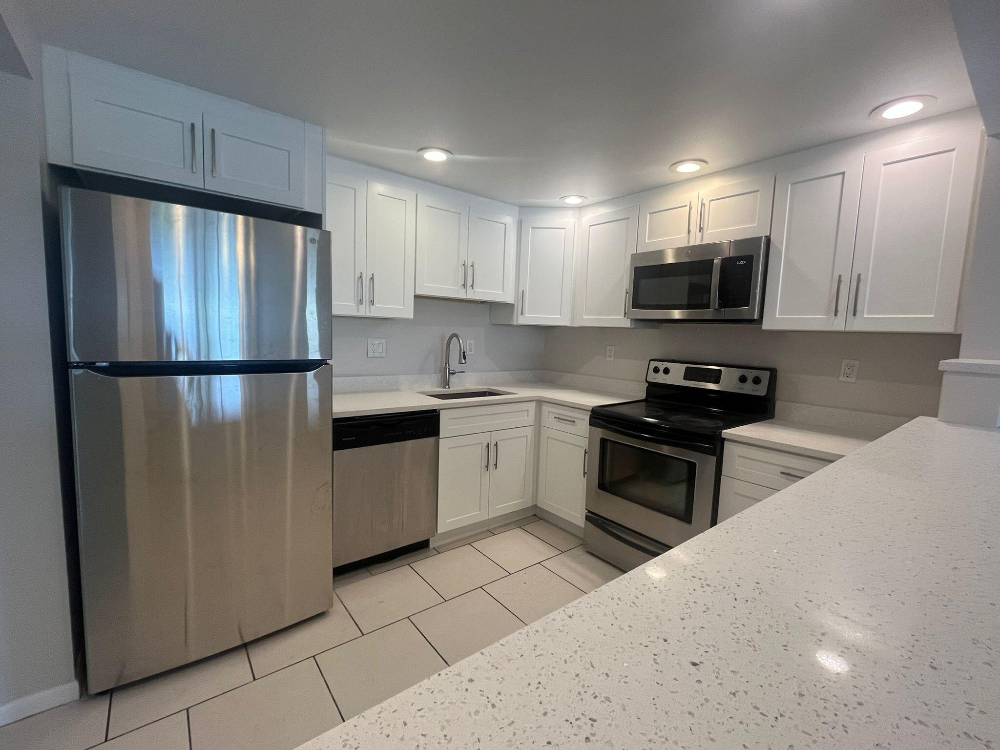 Beautifully Updated 2BD/2BA Condo in All-Ages Community - West BocaMove right into this fully updated unit featuring a brand-new kitchen with white shaker cabinets, quartz countertops, and modern finishes throughout. Both bathrooms have been tastefully renovated, and the home includes a full-size washer and dryer for your convenience. Enjoy relaxing on your private screened-in patio. Located in a well-maintained, all-ages community in desirable West Boca - close to shopping, dining, parks, and top-rated schools