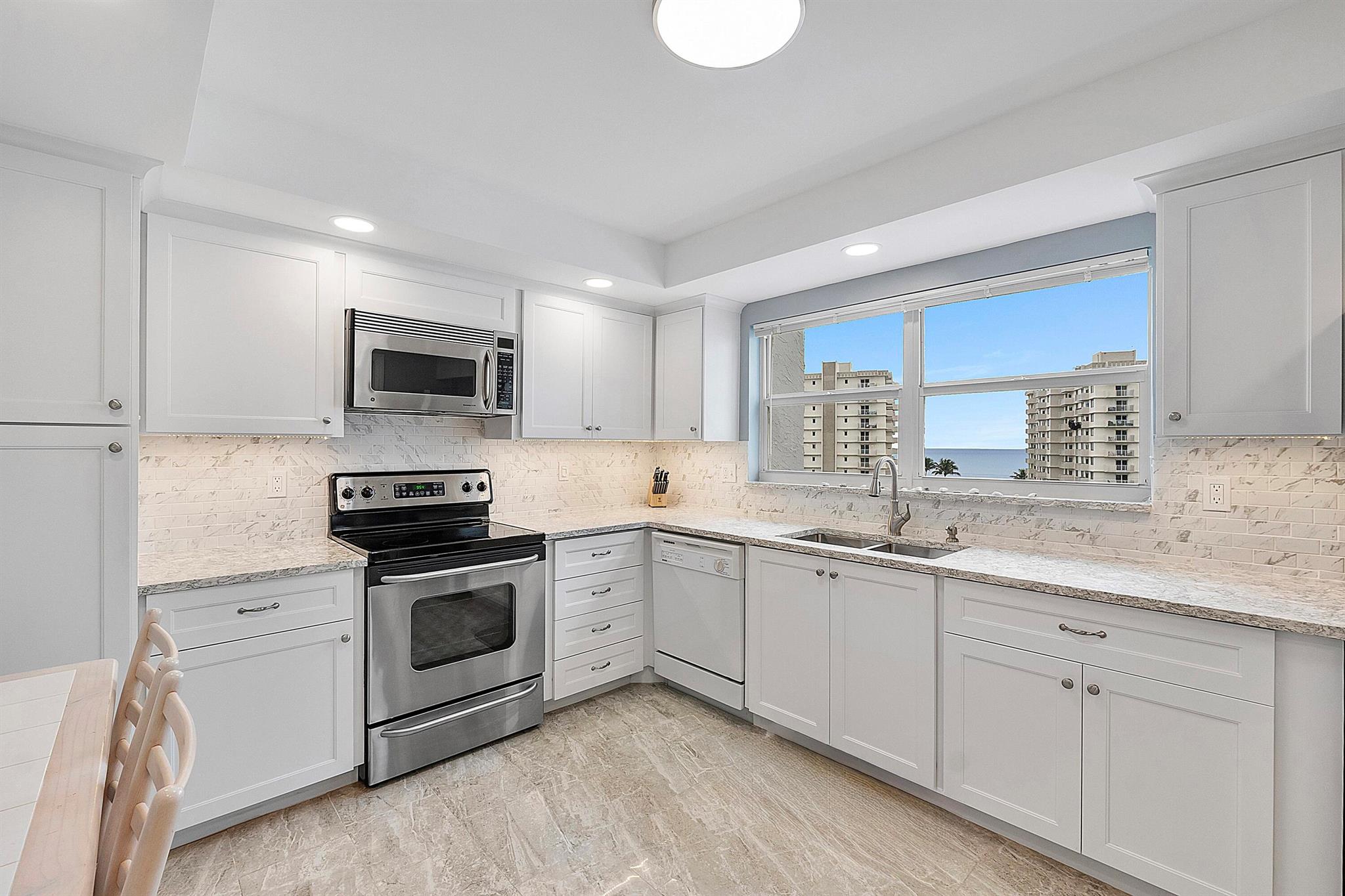 Seagate of Highland Beach is ensconced on a Barrier Island in the Exclusive Town of Highland Beach 2/2 COMPLETELY REMODELED CORNER UNIT WITH OCEAN & INTRACOASTAL VIEWS. This Property has the Ideal Height & Vantage to enjoy the Breathtaking Private Views. From the moment you enter the Corner residence, your eyes are captivated by the Ocean & Intracoastal. The views provide a Luxury of choosing between the Ocean or Intracoastal. This property includes covered parking in front of the A Building, Wood & Tile Flooring, NEW BATHROOMS with new Vanities , New Tub & Frameless Shower Door, New Updated Big Kitchen with New Cabinetry & Stainless Steel Appliances, New Bi-Folding Louver Doors & Entry Door, New Electrical and Electrical Panel, Smooth Ceilings, Full Impact hurricane Balcony