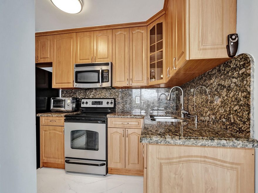 Stunning and meticulously renovated 2-bedroom, 2-bathroom residence ideally situated just across the street from the ocean. Step into a bright, airy living space with an open-concept layout that connects the living, dining, and kitchen areas. A pristine look of white porcelain flooring, extending throughout the unit, and hurricane-impact windows create a welcoming atmosphere. The main suite features a generously sized bedroom, a beautifully appointed en-suite bathroom, and a large closet. WHITTIER TOWERS is a boutique building in a charming town, Lauderdale by the Sea, close to the Pier, restaurants, supermarkets, coffee shops, and other amenities. 1 Covered parking space. Fully furnished. Annual lease. Easy to show.