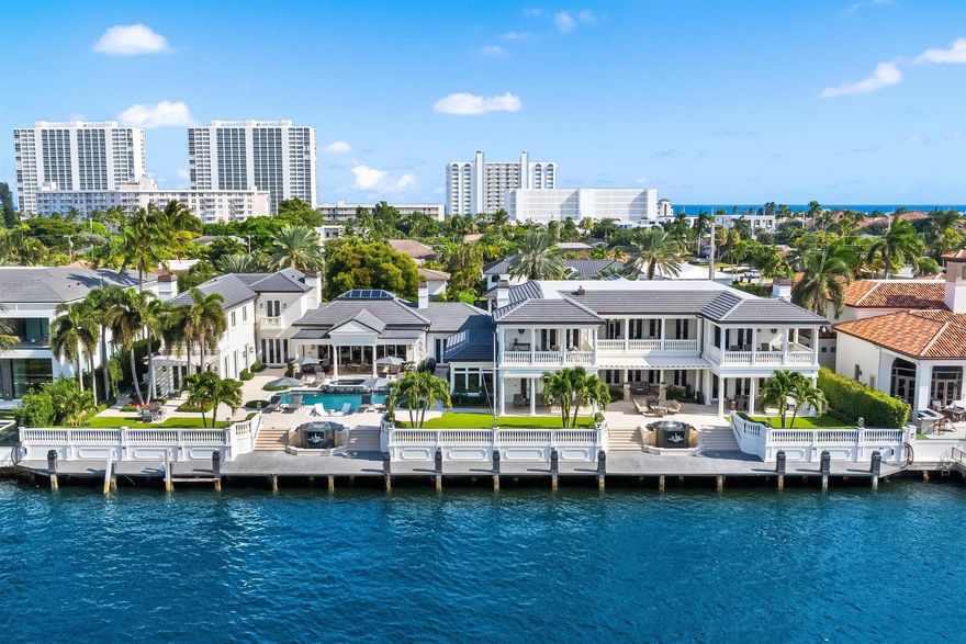 Experience the pinnacle of coastal luxury in this fully reimagined Intracoastal estate, set on 200 feet of prime waterfront in Boca Raton's prestigious Estate Section. Behind private gates, this expansive compound offers more than 12,000 square feet of refined interiors and over 17,000 total square feet across eight bedrooms, thoughtfully arranged between the main residence and a separate guest home. The layout is exceptional: the main residence features six beautifully appointed bedrooms, while the guest home includes two additional bedrooms, a full kitchen, a spacious living room, its own private entrance, and even an additional 1-car garage dedicated to this suite