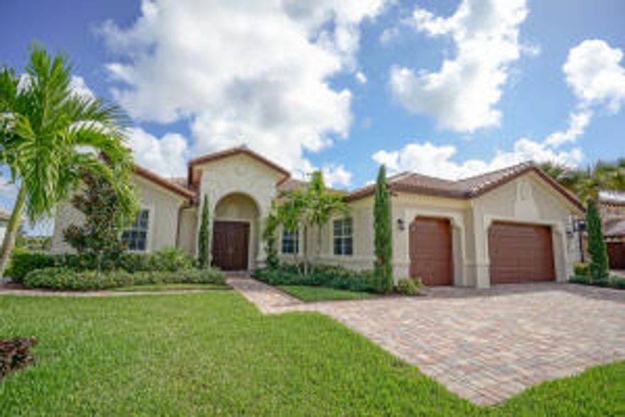 New and exquisite one level pool home with panoramic water views offering 5 bedrooms 4 full baths, 3 car garage and a spacious 3,956 square feet under air.  This highly sought after floor plan is nestled in the gated community of Rialto, in the heart of Jupiter.  Enter the double doors into the circular foyer and be instantly captured by the expansive views through the living room windows.  The flooring is a gorgeous high gloss 24" porcelain tile laid on the diagonal, and crown moulding is found throughout the entire home.  The office/4th bedroom is directly off the foyer towards the front of the home separate from any living space for extra privacy.  The massive grand living room with wall to wall picturesque windows is the ideal place to gather and entertain.