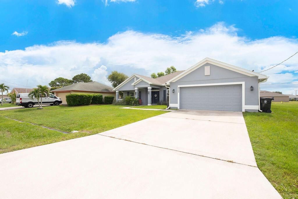 Photo of 411 NW Ravenswood Lane, Port Saint Lucie, FL 34983 (MLS # R11004369)