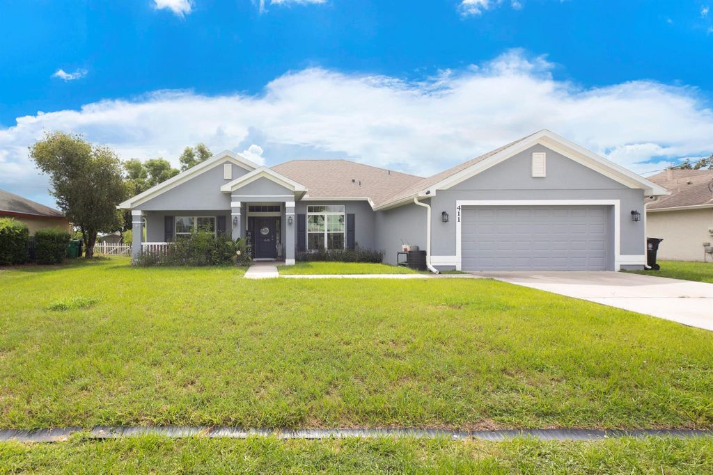 Photo of 411 NW Ravenswood Lane, Port Saint Lucie, FL 34983 (MLS # R11004369)