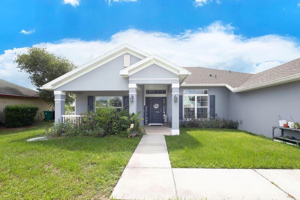 Photo of 411 NW Ravenswood Lane, Port Saint Lucie, FL 34983 (MLS # R11004369)