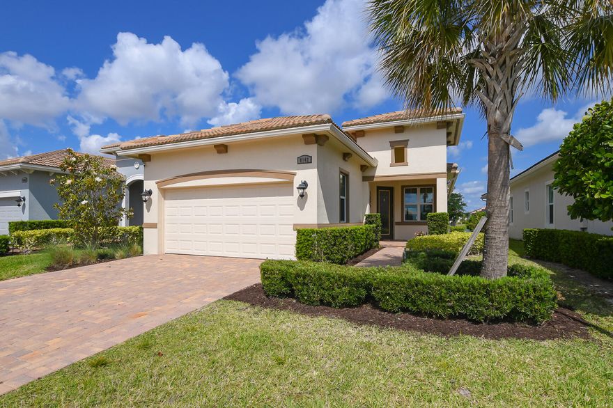 Beautiful Bella model in Verano at PGA Village! Features CBS Construction, 2 BR's, 2 BA's + Den/Office with double door entrance.  Open floor plan with volume ceilings, hurricane impact windows, spray installation and stylish updates throughout. Tile in main living areas and NEW vinyl flooring in bedrooms. Freshly Painted interior throughout & move in condition! The kitchen features quartz countertops, white cabinetry, breakfast bar, pantry, stainless steel appliances, glass backsplash, and a cozy eat-in area. Enjoy Florida living on the extended 22 x 16 screened lanai with pavers and peaceful lake views. Lovely Fenced backyard, 2 Car Garage includes:  cabinetry, and workbench with epoxy flooring. Golf cart negotiable. One-year home warranty included! DO NOT WAIT PRICED TO SELL! HOA includes:  Recreation clubhouse Talavera, lawn care, exterior pest control, cable, high speed internet, alarm monitoring & manned gated security. PGA Verano is a resort style community with 27 pickle ball courts, tennis courts, fitness centers with state of the art equipment, indoor and outdoor pools, sauna, and dog park. Exceptional Talavera Social Club 19,000 sq ft offers something for everyone! There is a golf cart path to the PGA Golf Club which offers 3 Public Championship Golf Courses and Private Course (membership optional). Located minutes from Shopping, Restaurants, Activities, Entertainment & Even Home of the New York Mets Spring Training. Only 45 Minutes from Palm Beach Airport and a growing area. The Treasure Coast has beautiful Waterways for the Beach, Fishing & Boating. Due to the location of the Treasure Coast the Weather is delightful!